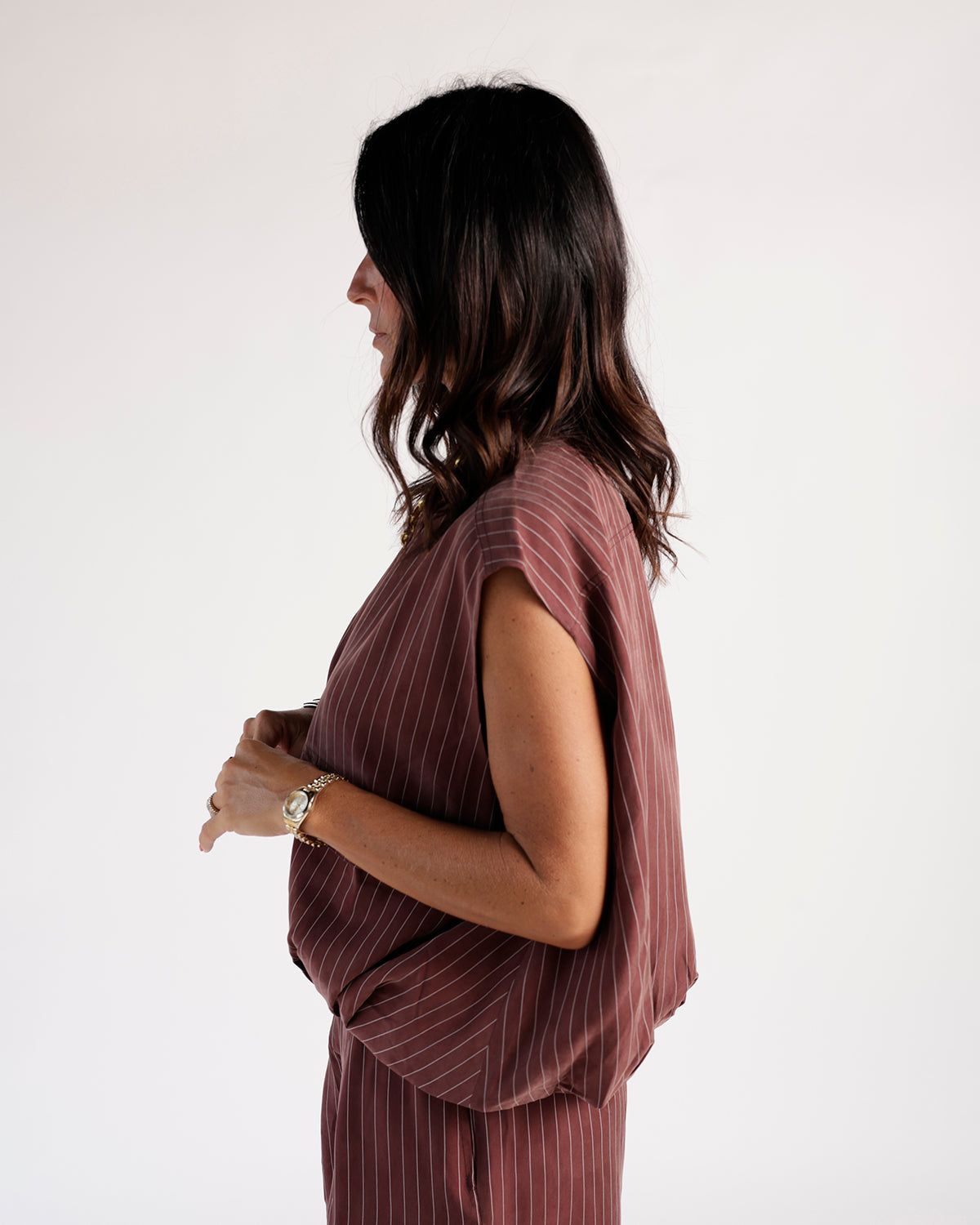 Sleeveless mulberry striped cargo zip vest, side profile view, relaxed fit