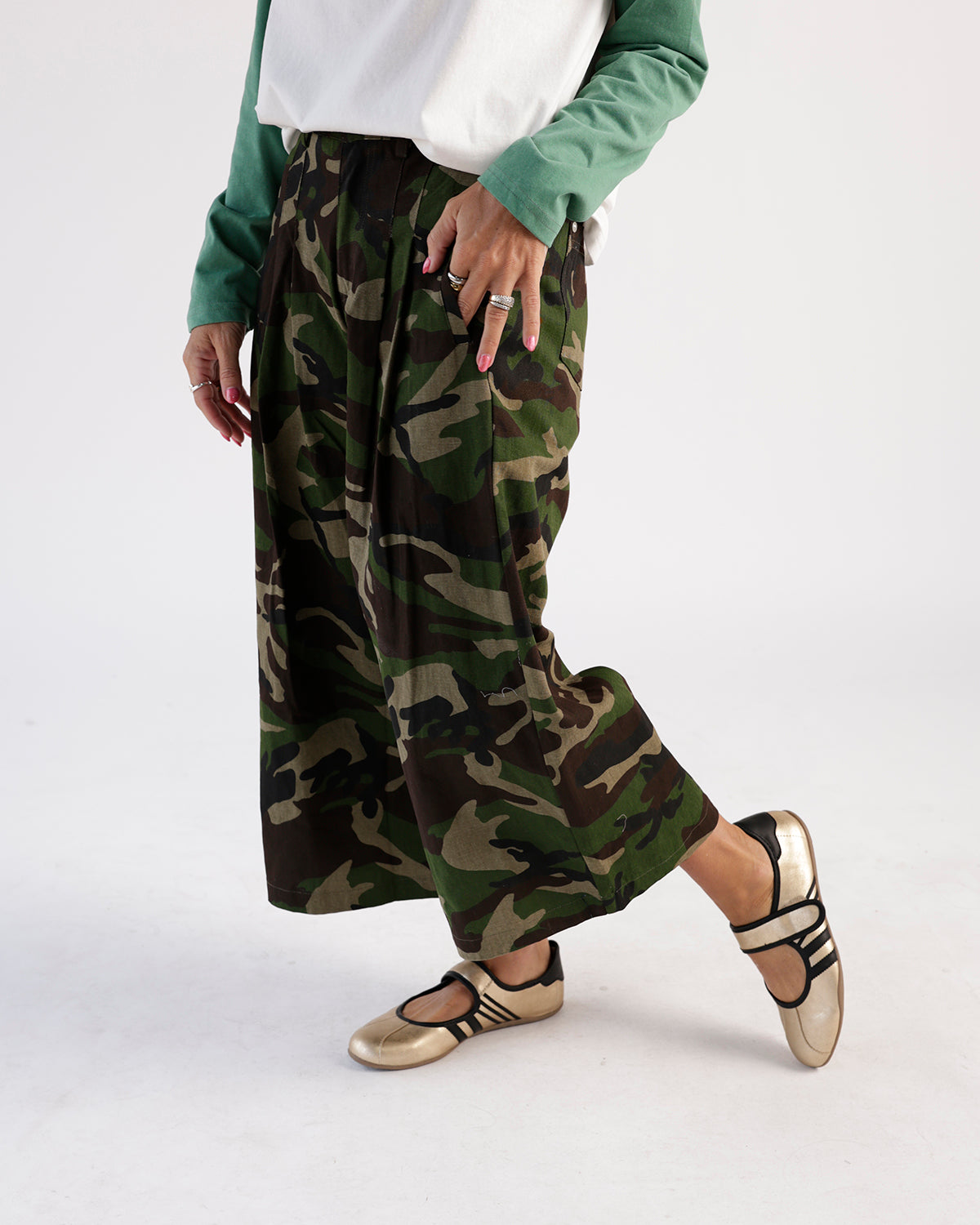 Wide-leg camouflage maxi shorts in green, brown, and black pattern with elastic waist