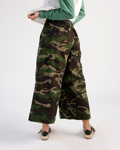 Wide-leg cropped camo pants with elastic waist, worn from behind