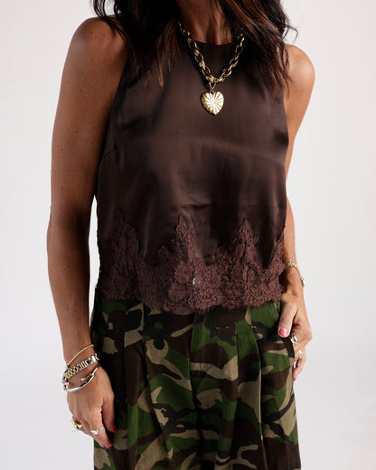 Chocolate brown satin sleeveless top with lace hem trim, worn with camo skirt