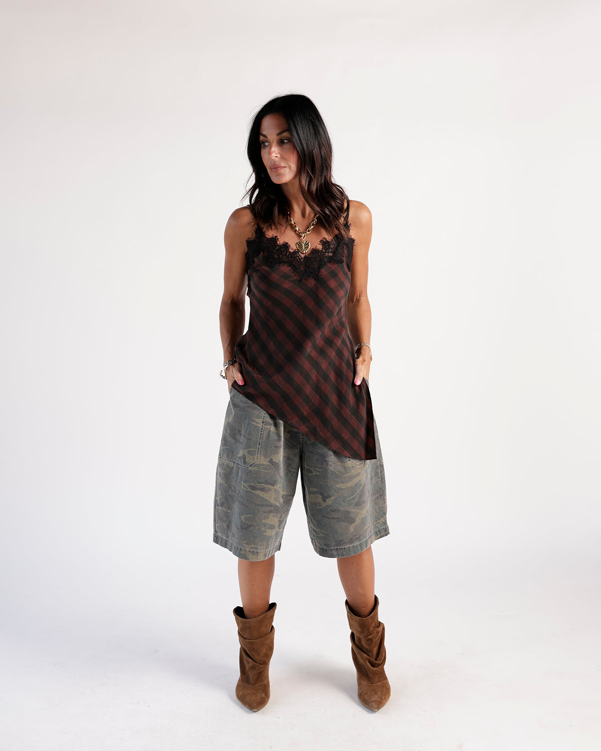 Olive camo cargo shorts, relaxed wide-leg fit, knee length, worn with boots