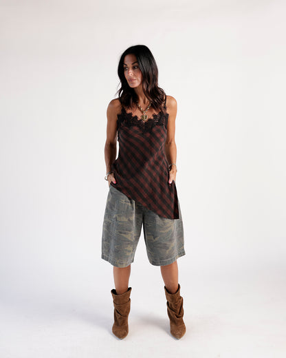 Olive camo cargo shorts, relaxed wide-leg fit, knee length, worn with boots