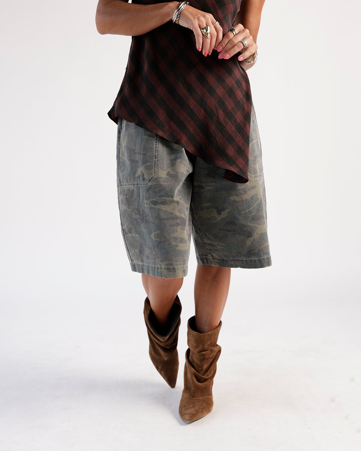Faded camo print cargo shorts in olive and grey, knee length, relaxed fit.