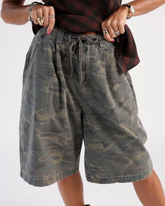 Stay stylish with these camo shorts. Features a faded olive camouflage print, drawstring waistband, and front patch pockets.