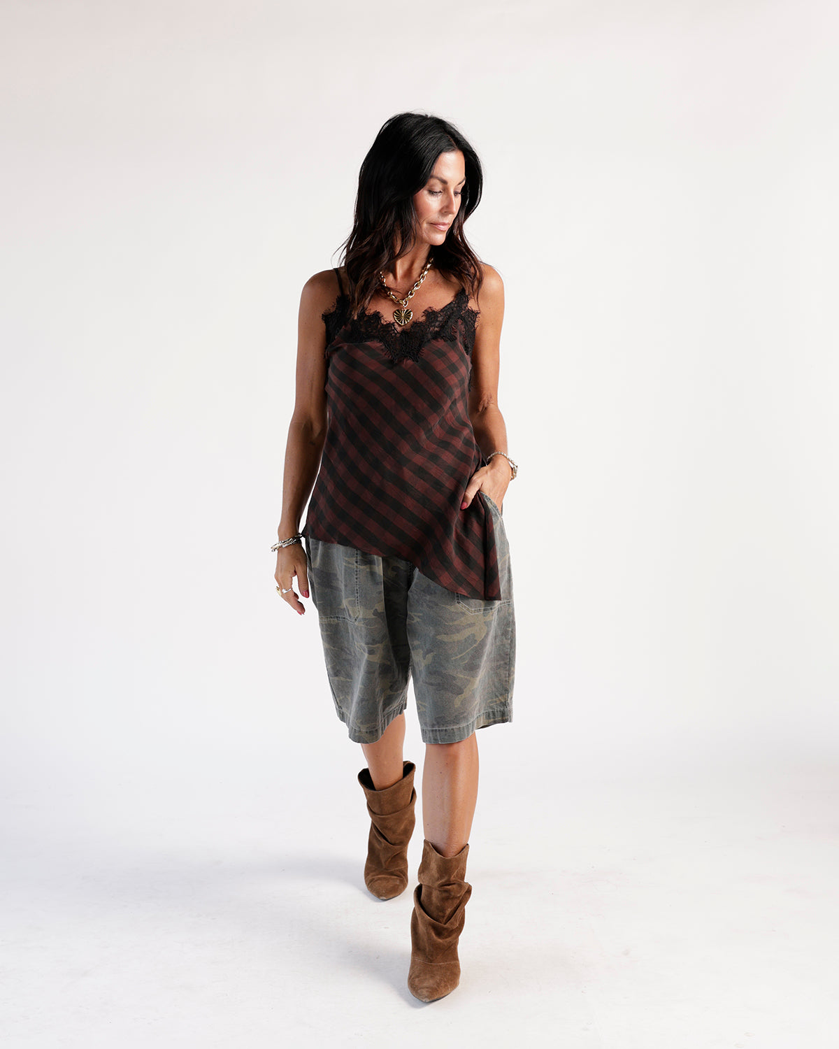 Olive camo cargo shorts, knee-length, relaxed fit, worn with brown suede boots
