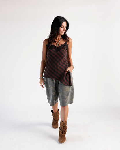 Olive camo cargo shorts, knee-length, relaxed fit, worn with brown suede boots
