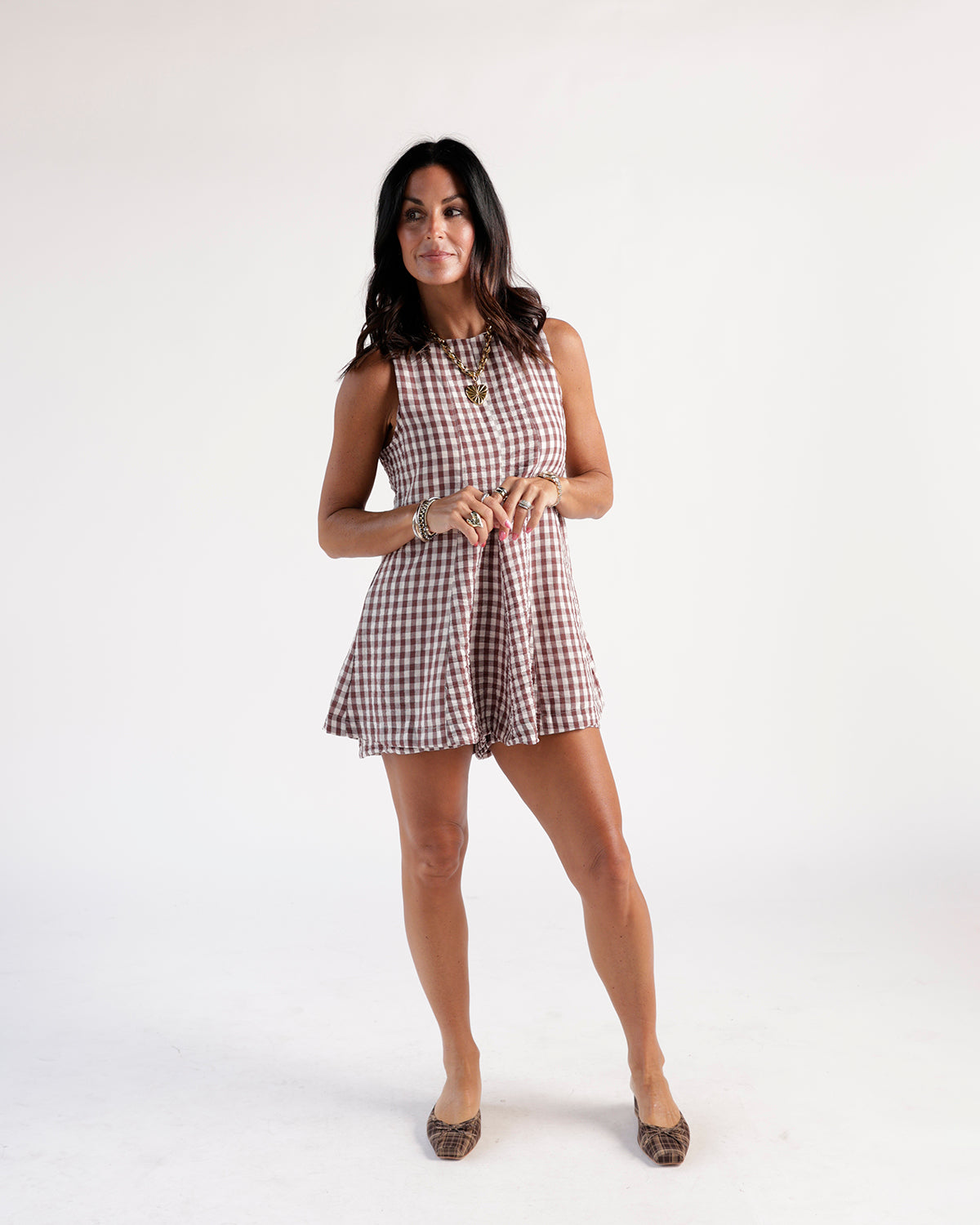 Women's gingham sleeveless A-line dress with a scoop neckline and back zipper. Perfect for warm days and casual outings. Easy to wear and care.