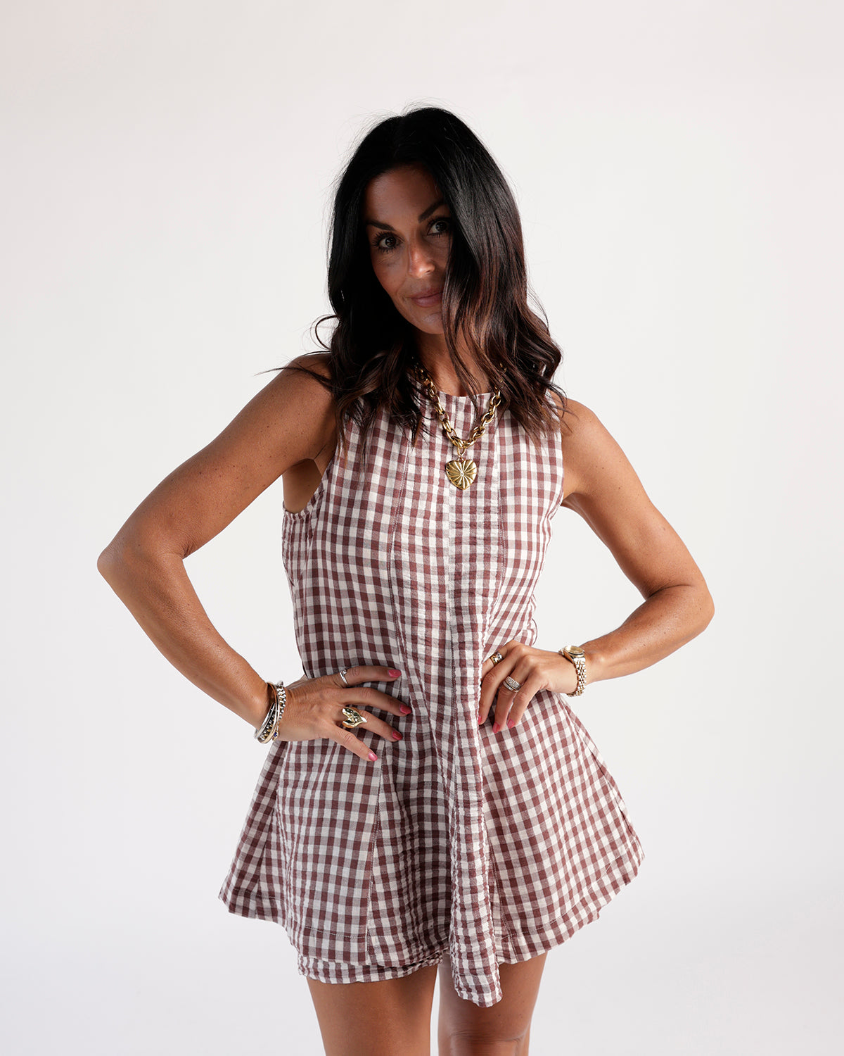 Brown and white gingham sleeveless mini dress with flared skirt and button front