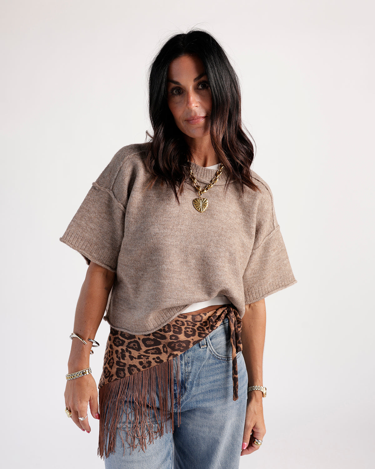 Effortless staple sweater crafted from a soft knit blend. Timeless and versatile, perfect for layering and everyday wear. Offers relaxed, flattering fit.