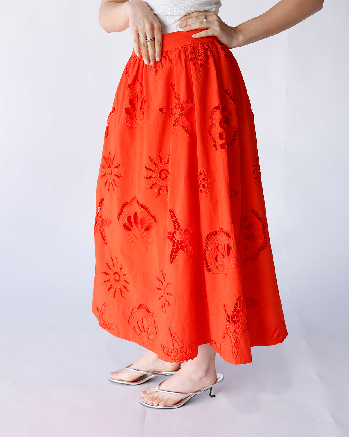 bright orange midi skirt with sea theme eyelet lace detailing throughout