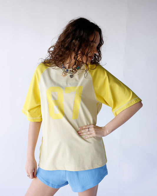 yellow and cream 87 varsity graphic short sleeve tee women