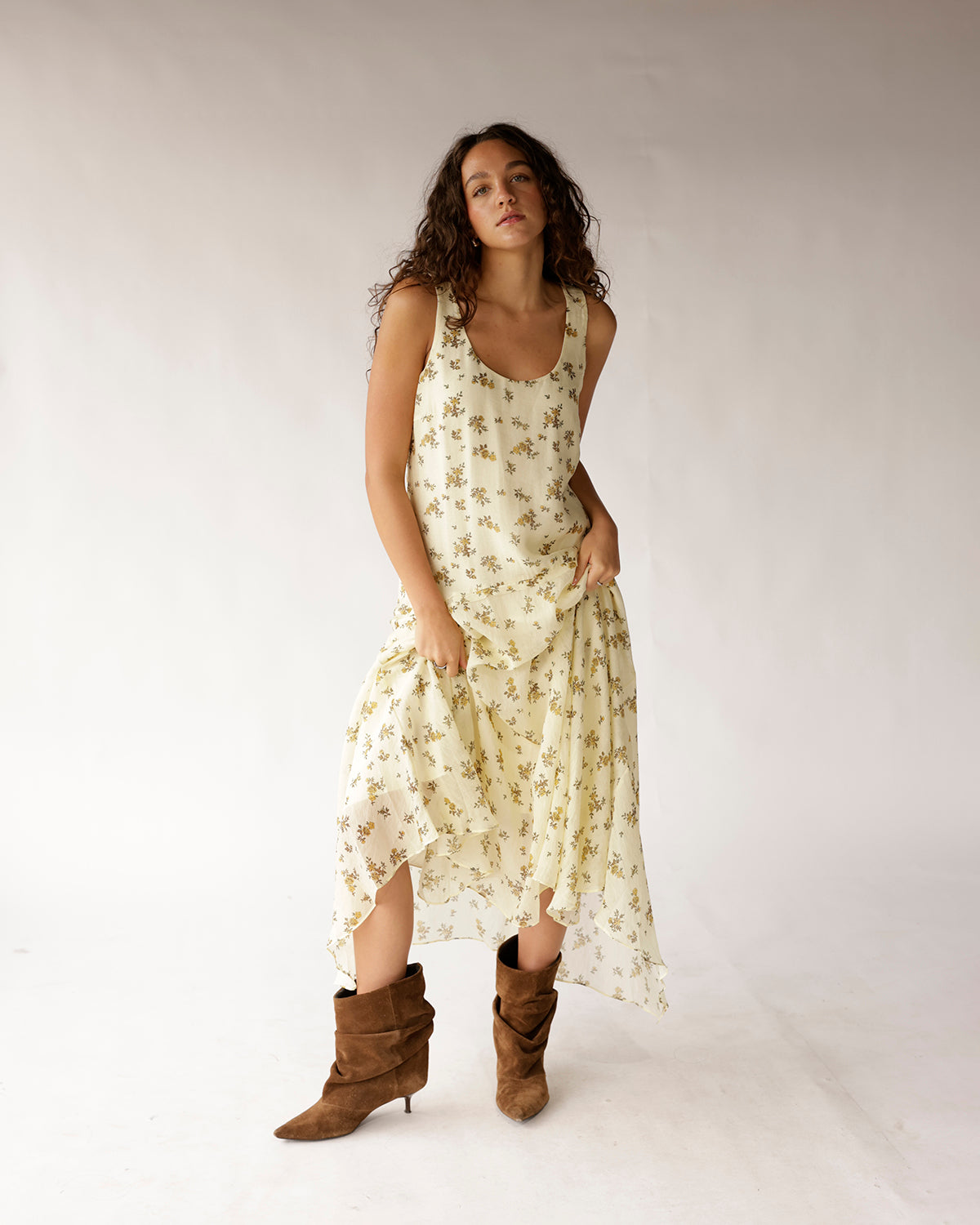 Fall in love with this floral maxi dress featuring a flattering V-neckline, drop waist, flowy asymmetric hem, sleeveless design, and fully lined pull-on styling for effortless feminine style.