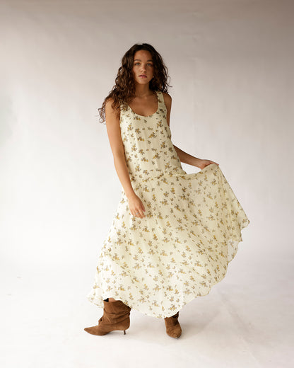 Cream floral drop waist maxi dress with wide straps, worn with brown suede boots