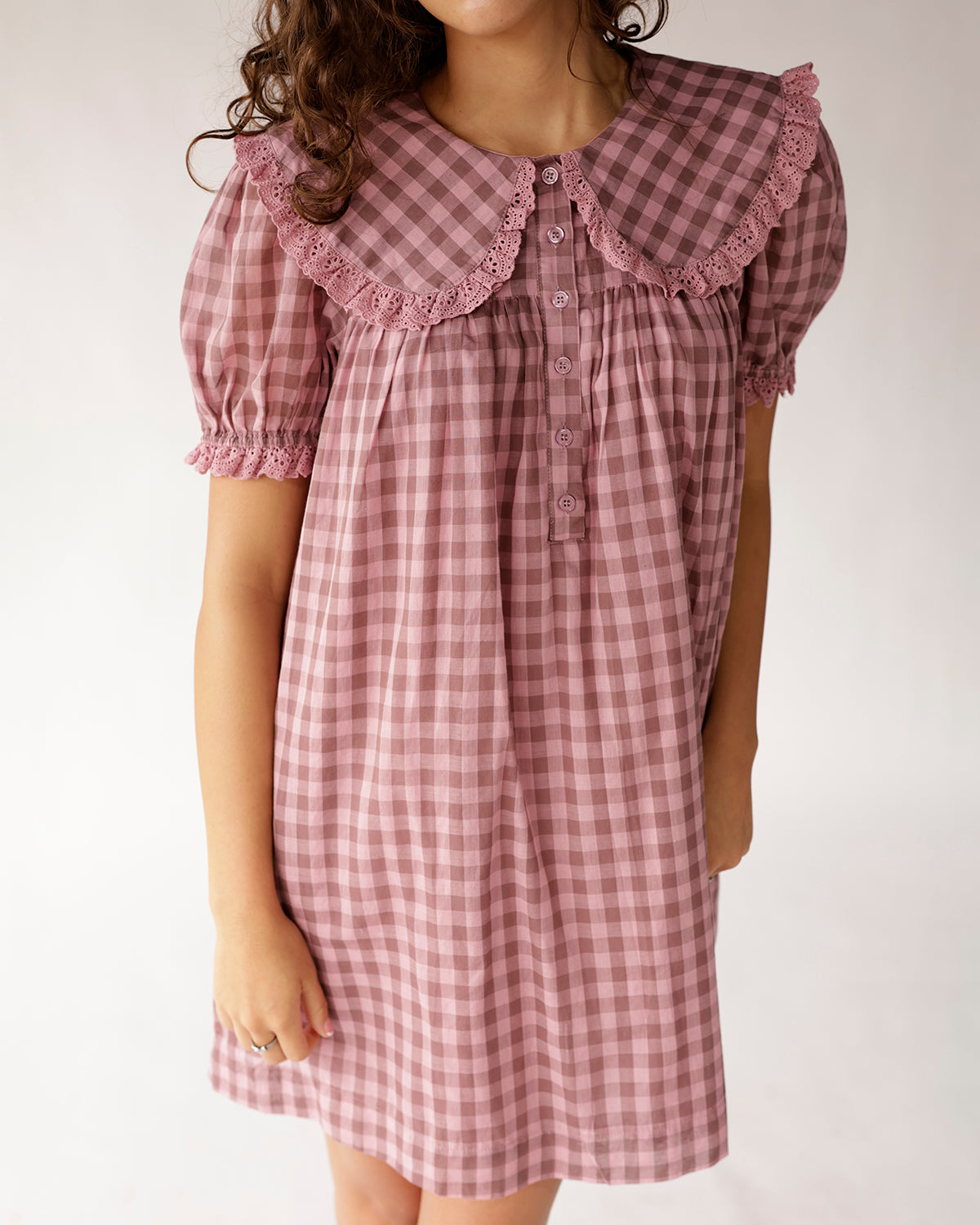 Pink gingham mini dress with lace peter pan collar and puff sleeves