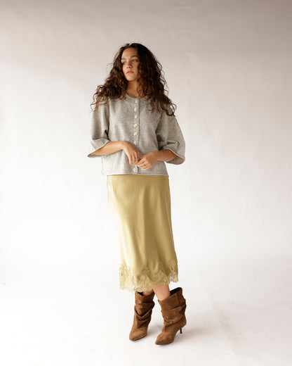 Gray cropped button-up knit sweater with wide sleeves and round neckline