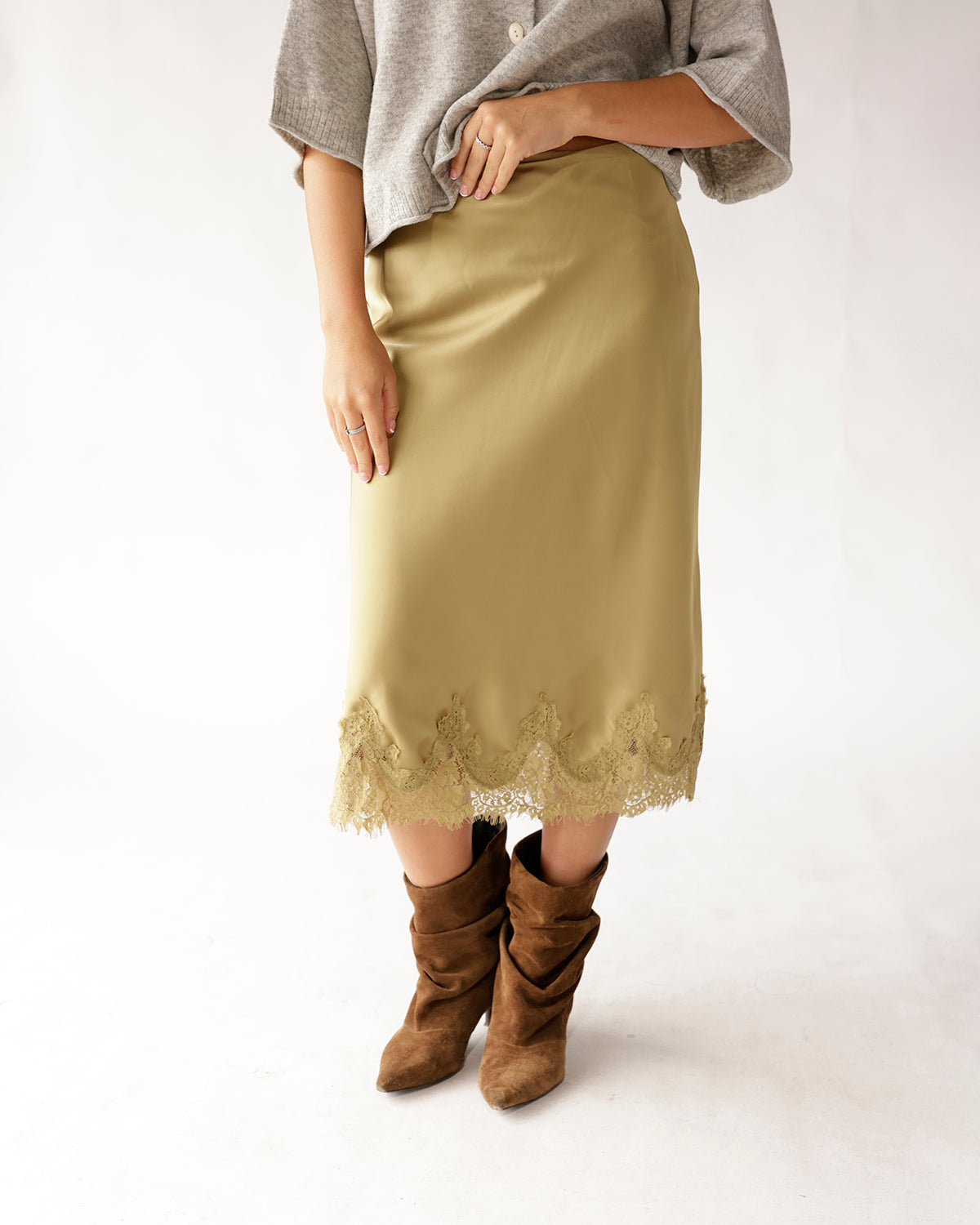 Classic and elevated, the Olive Branch Midi Skirt brings effortless sophistication to any outfit. Features lace trim and a seamless fit.