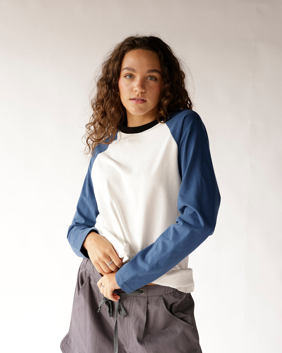 White and blue raglan long-sleeve baseball tee with black crew neck collar