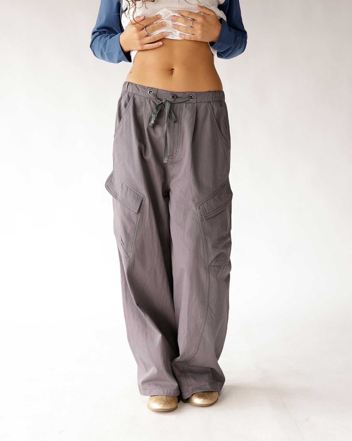 Gray wide-leg cargo pants with drawstring waist and side cargo pockets