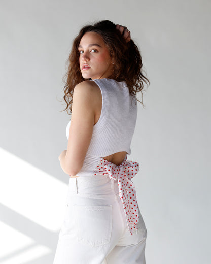 white sleeveless sweater with open back and polka dot tie tie back sleeveless white sweater