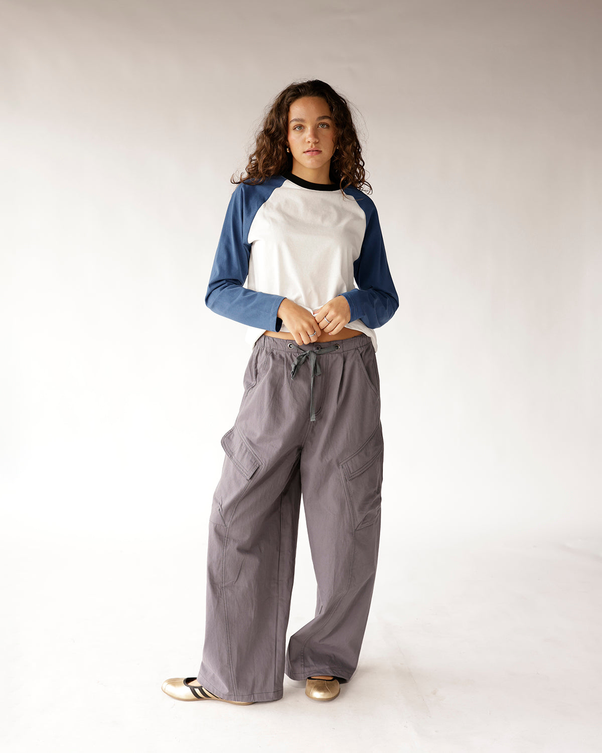 Wide-leg gray cargo pants with drawstring waist and side pockets