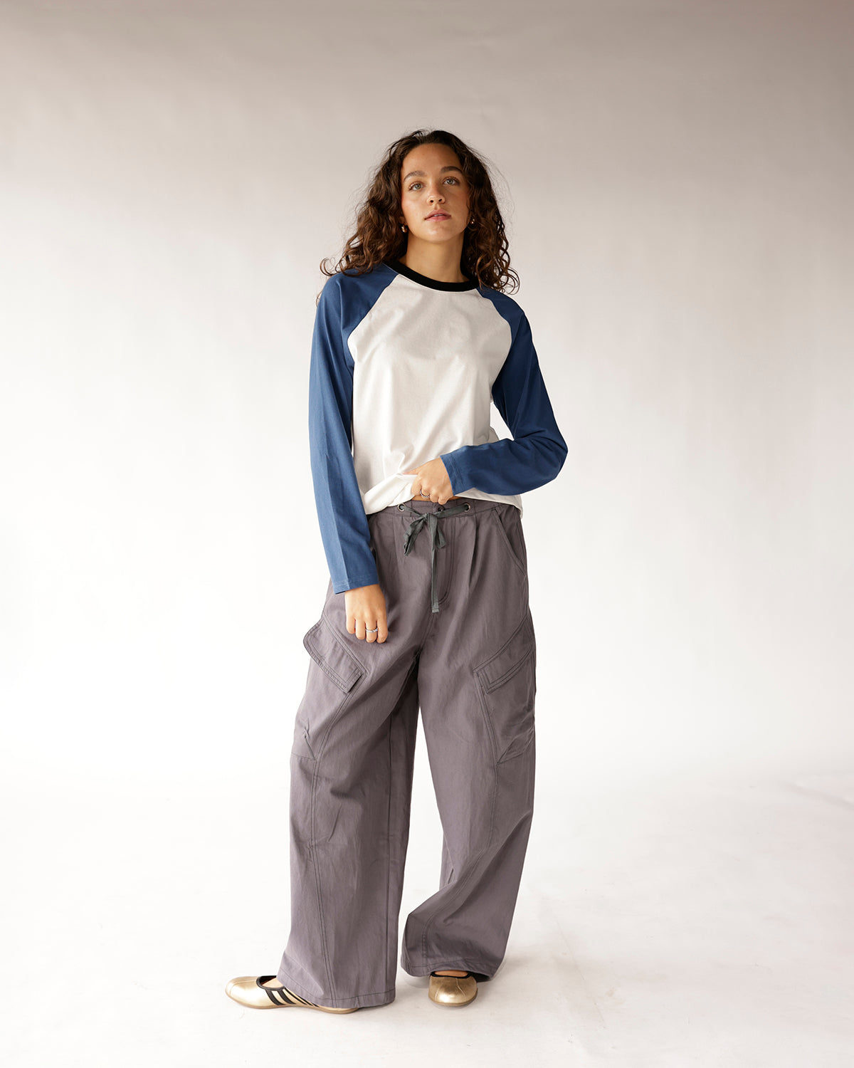 Wide-leg gray cargo pants with drawstring waist and large side pockets