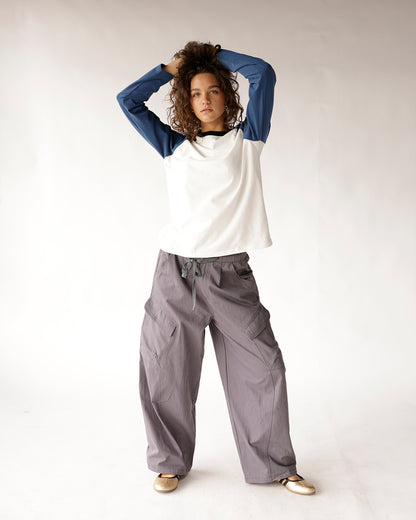 Wide-leg gray cargo pants with drawstring waist and multiple pockets