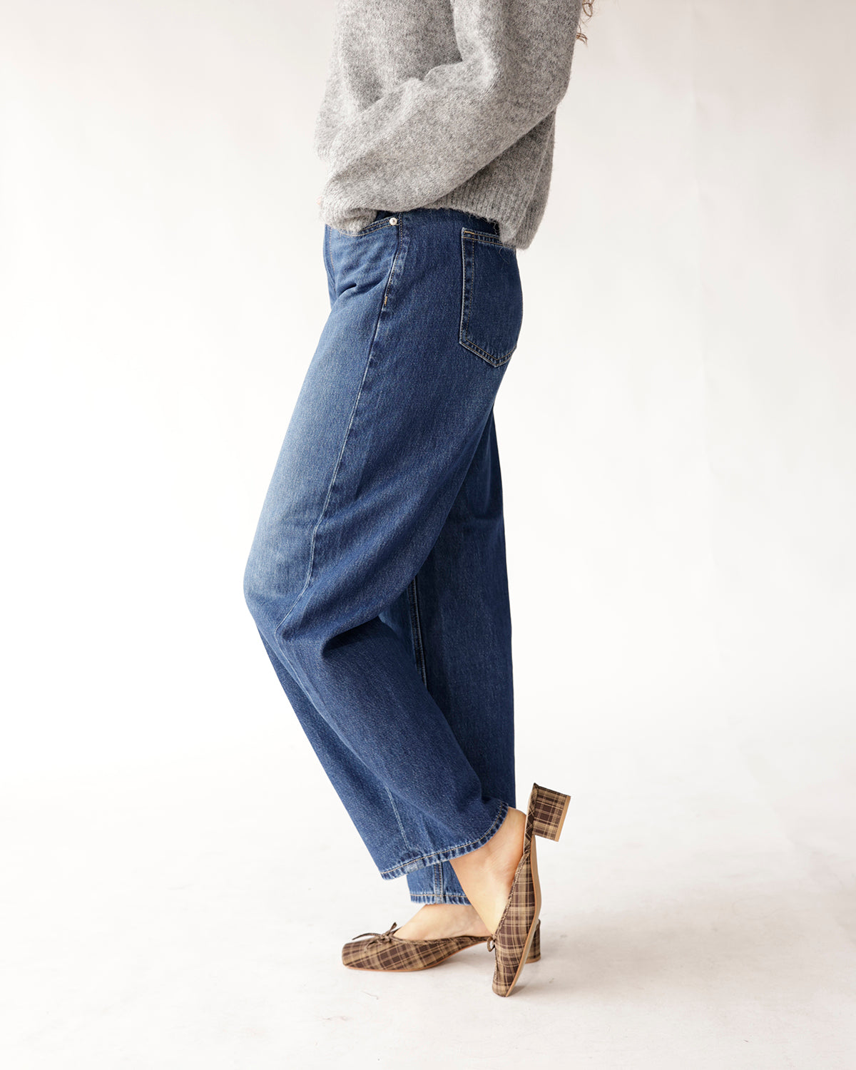 High rise relaxed barrel leg medium wash blue jeans, side view