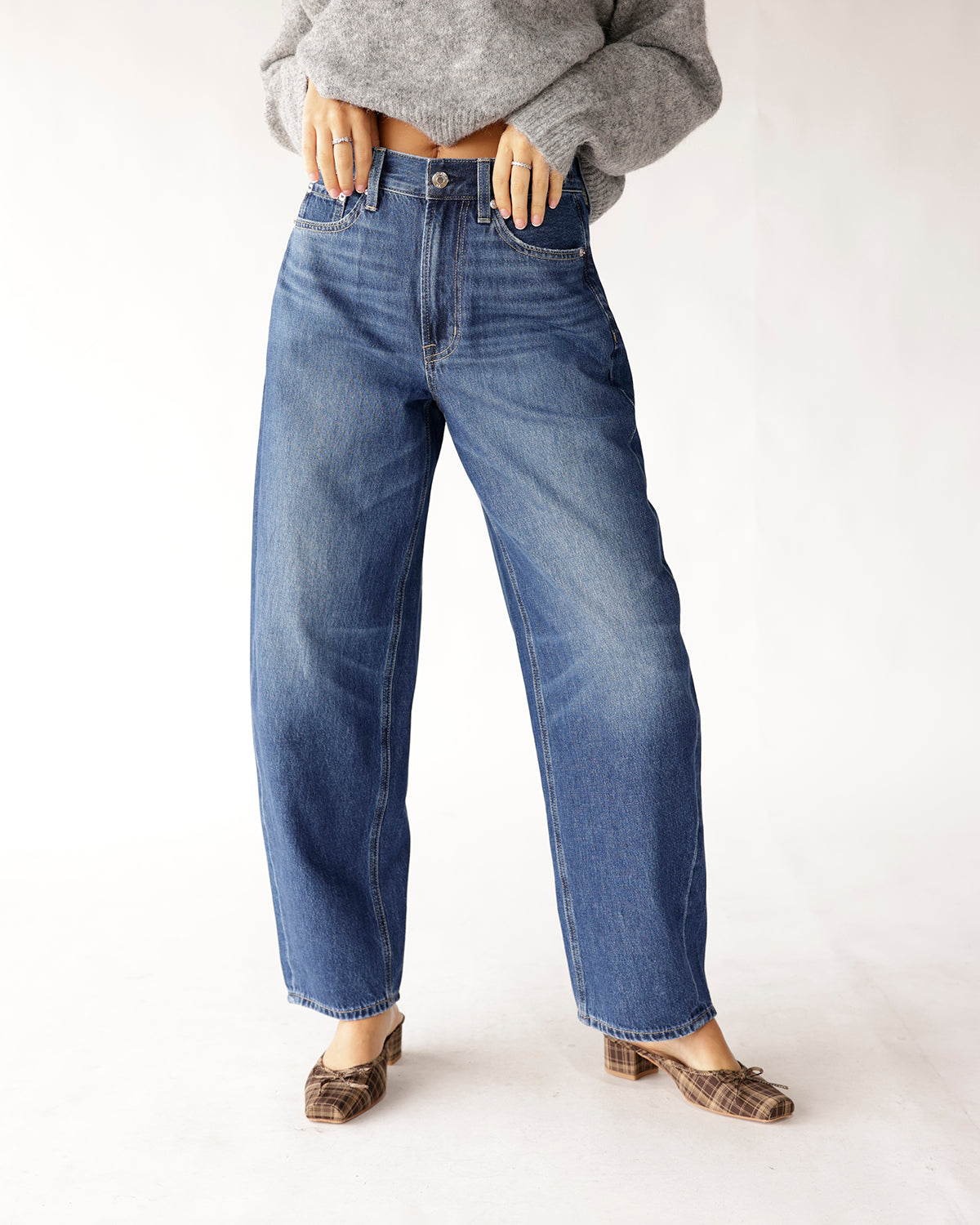 High rise relaxed barrel leg jeans in medium blue wash, wide leg fit