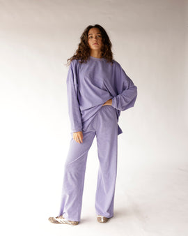 Relax in style with these lavender and dark purple striped wide-leg pants featuring a smocked elastic waistband, flowy silhouette, and soft, comfortable fit. Perfect for pairing with the matching top or your favorite basics for an effortlessly chic everyday look.