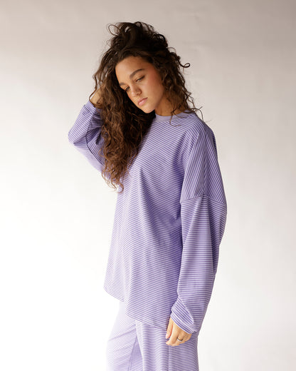 Oversized lavender striped long sleeve top with relaxed fit and crew neck
