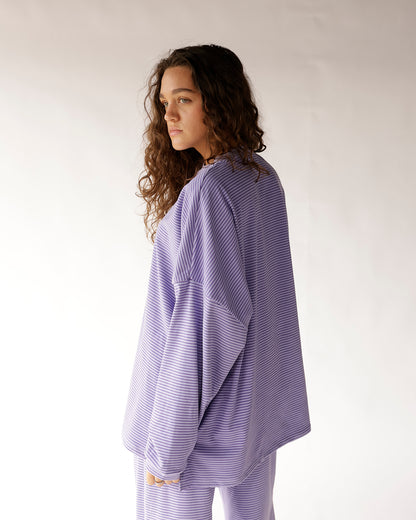 Oversized lavender striped long-sleeve top with drop shoulders, worn as a set