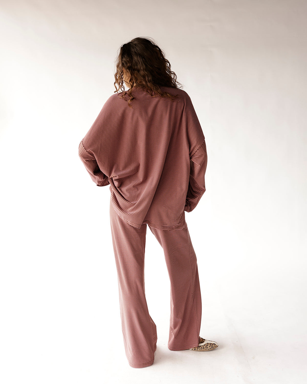 Oversized striped long sleeve top in mauve and burgundy, back view