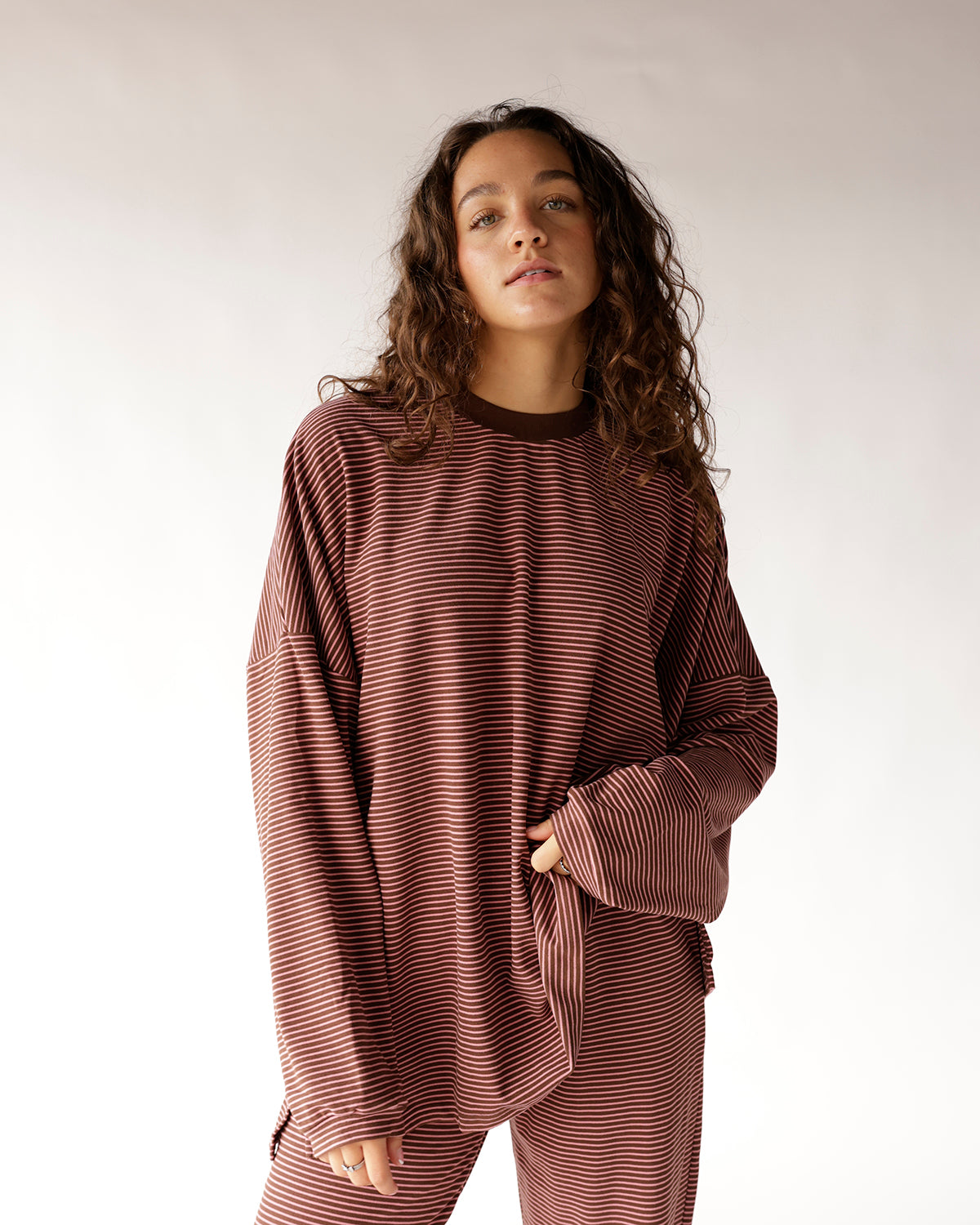 Oversized brown and cream striped long sleeve top with relaxed fit
