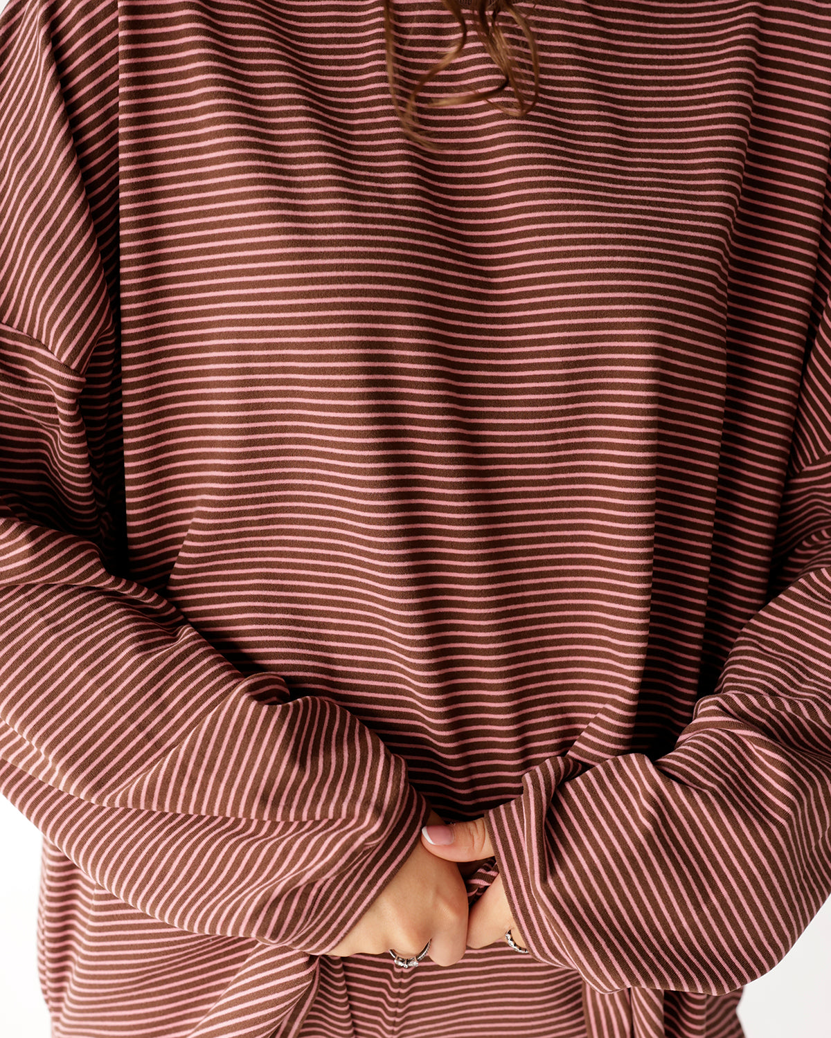 Oversized long sleeve top in brown and pink horizontal stripes with relaxed fit
