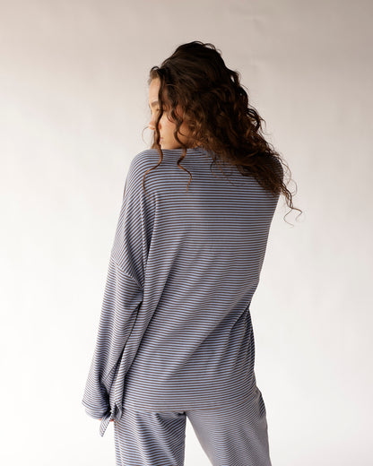Oversized dusty blue striped long sleeve top with wide sleeves, back view