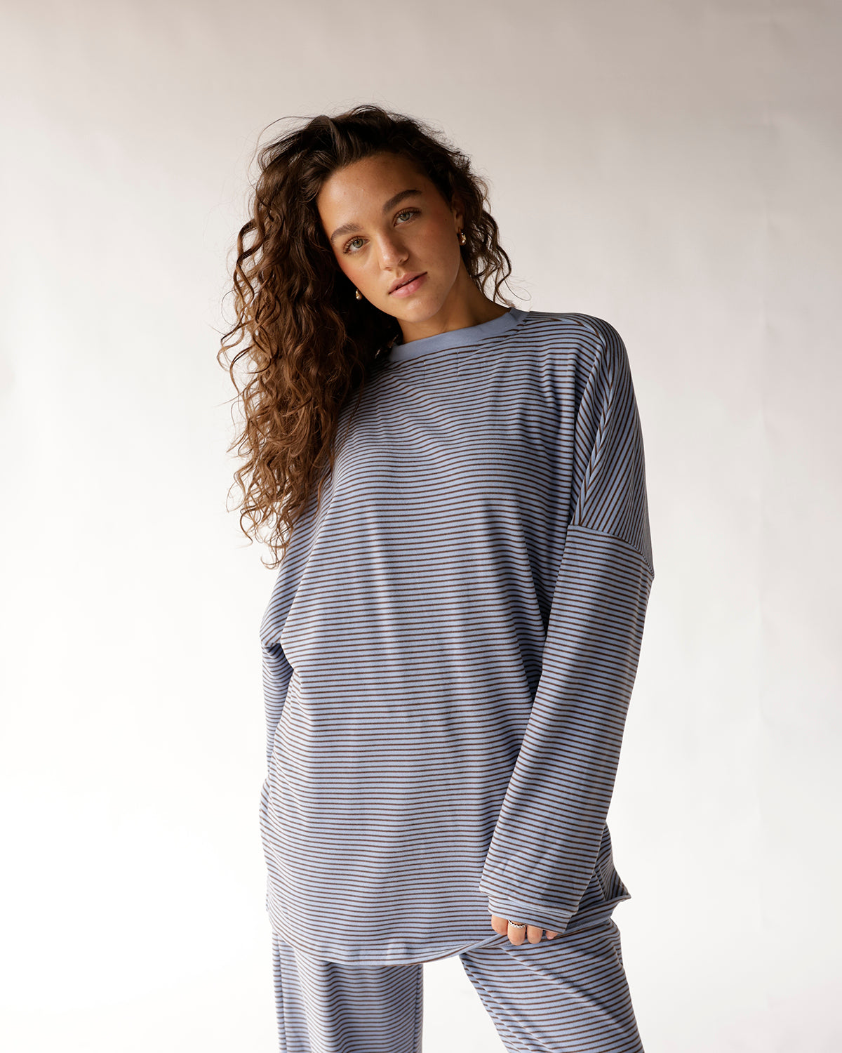 Oversized dusty blue striped long sleeve top with crew neck and dropped shoulders.