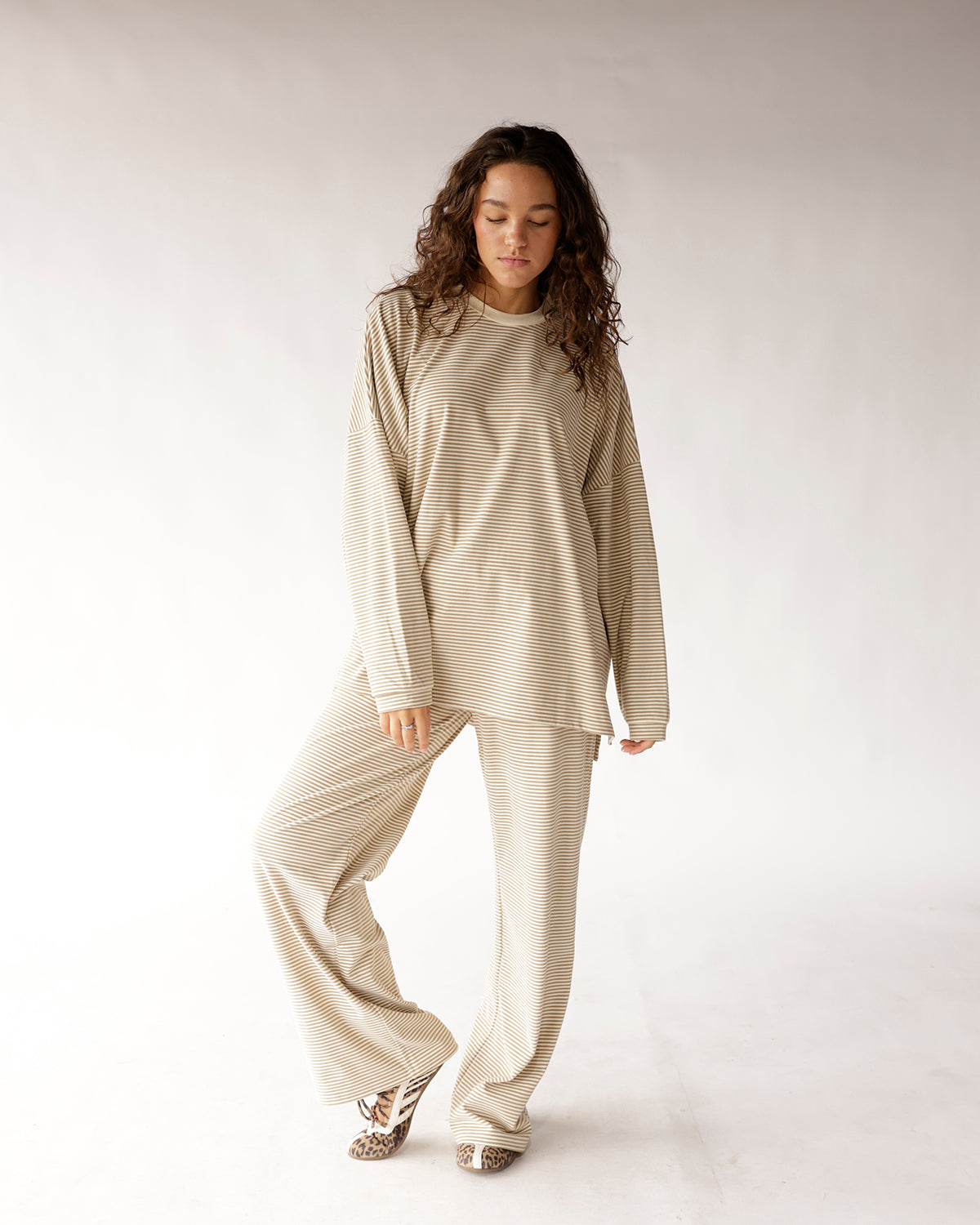 Oatmeal striped wide leg pants with matching long sleeve top and leopard slippers