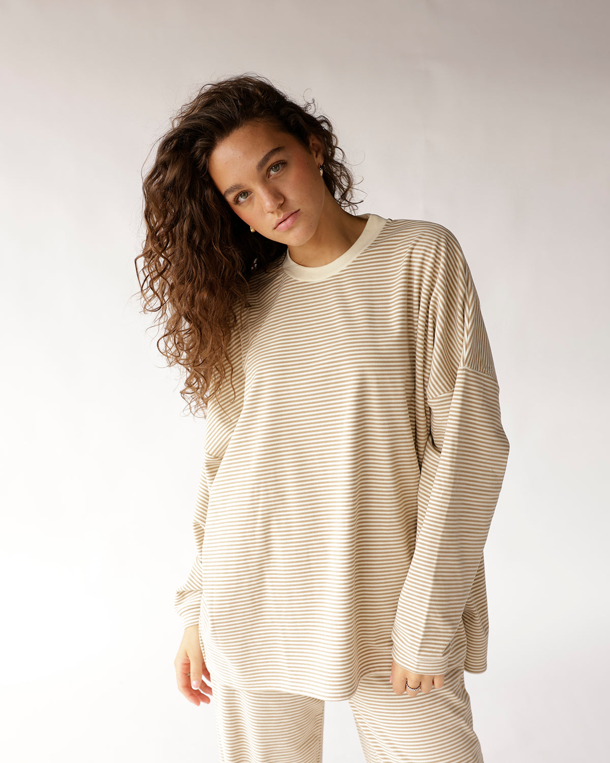 Oversized long sleeve top in cream and tan horizontal stripes with crew neck