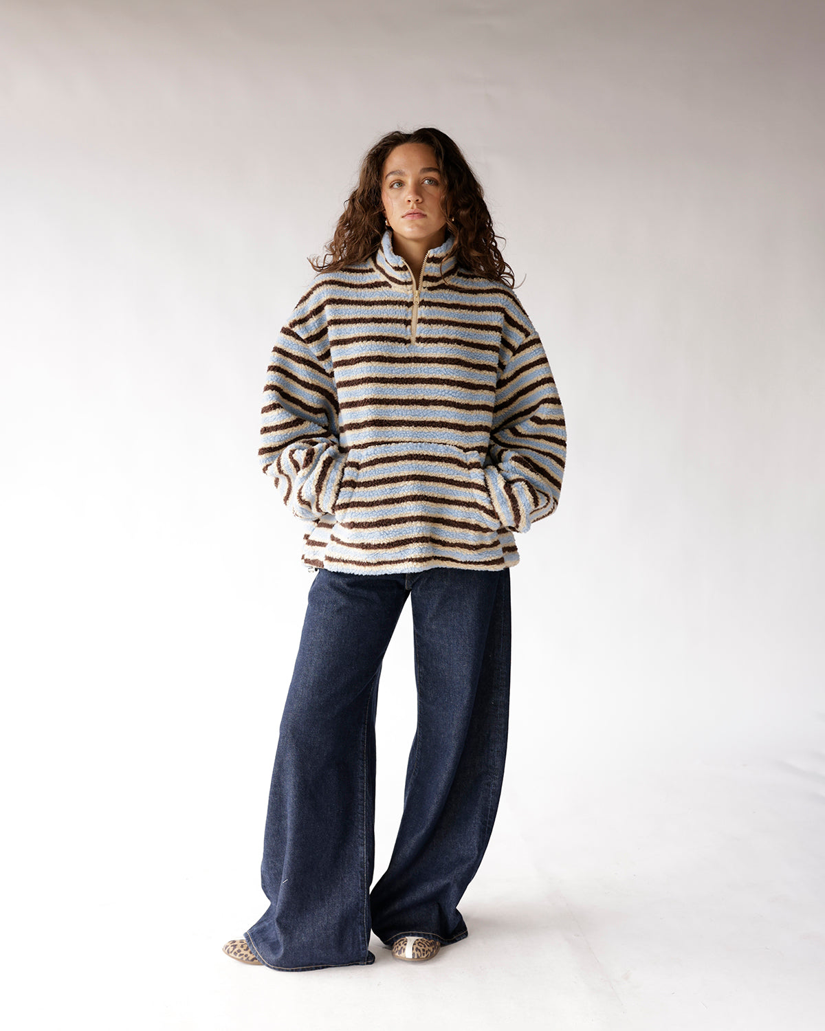Blue and brown striped sherpa quarter-zip pullover with kangaroo pocket