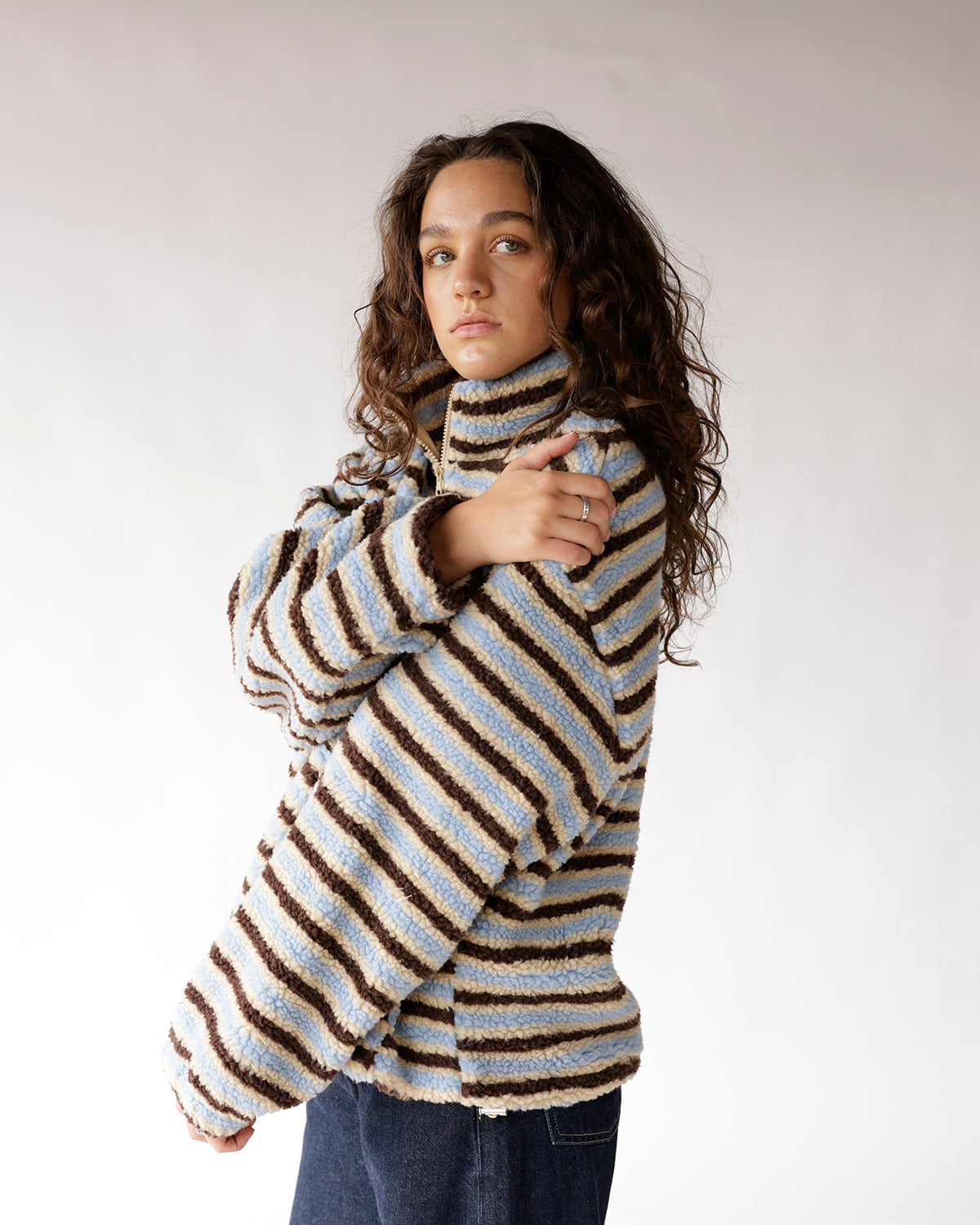Blue striped sherpa fleece quarter-zip pullover with turtleneck collar