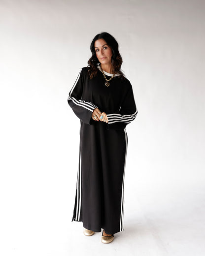 Black maxi track dress with white side stripes and long sleeves