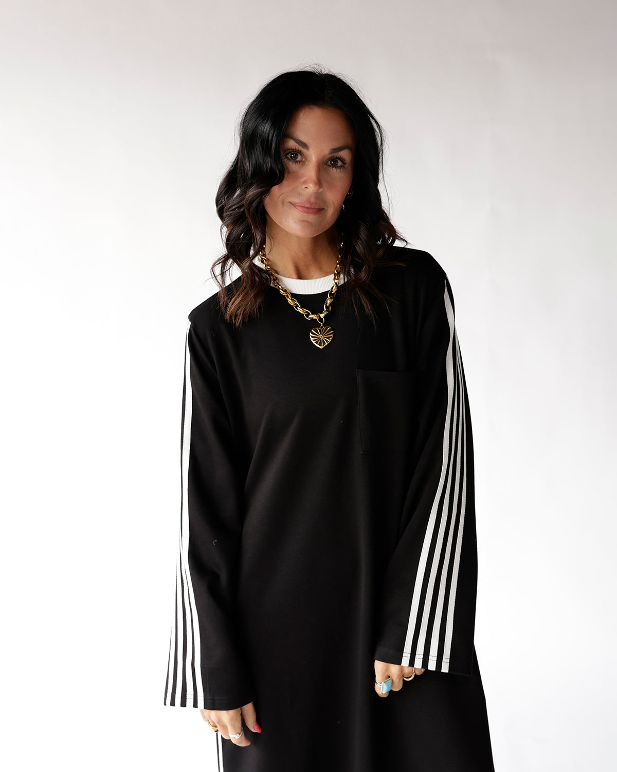 Black oversized long sleeve track dress with white side stripes and crew neck
