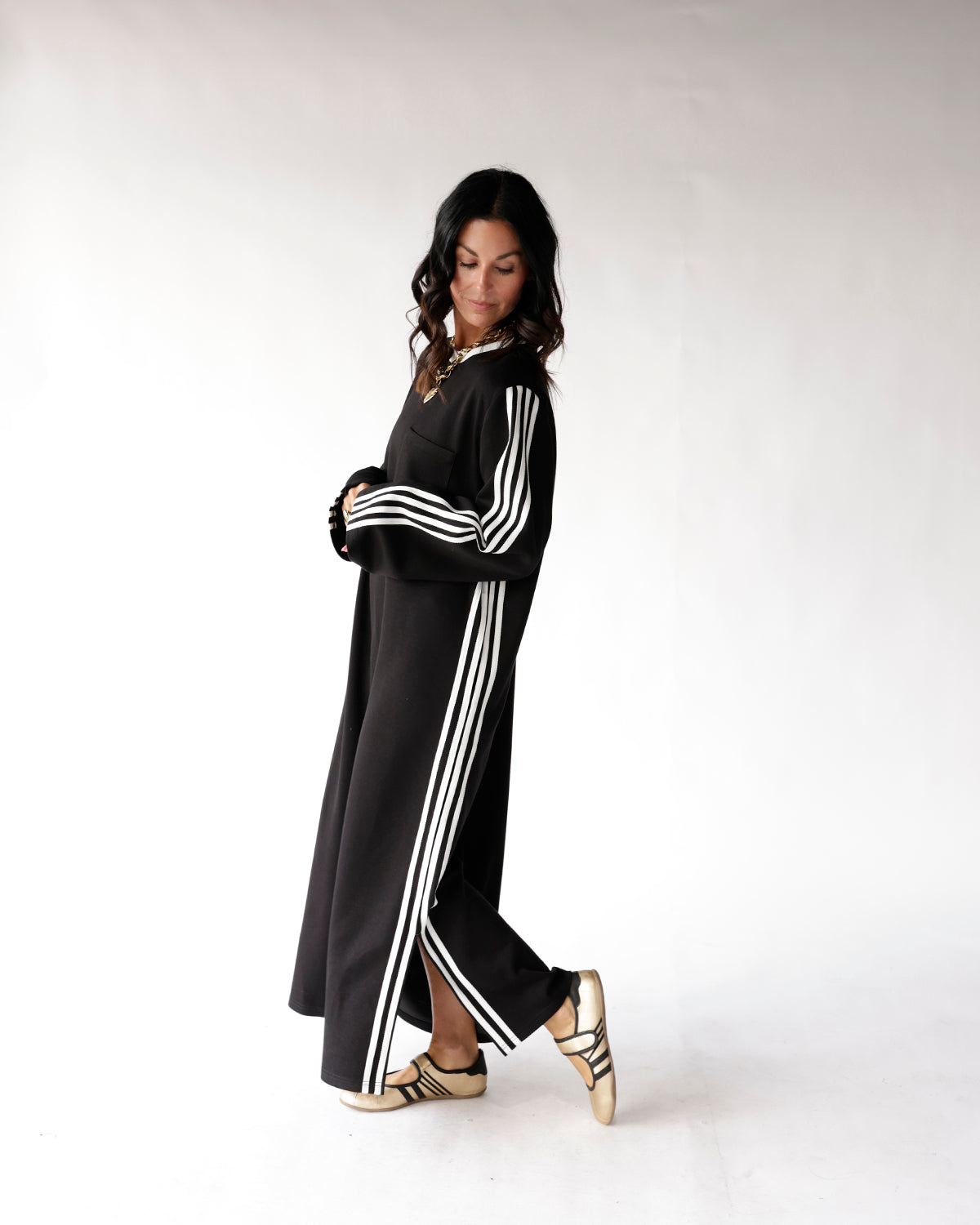 Black maxi track dress with white triple stripes on sleeves and sides