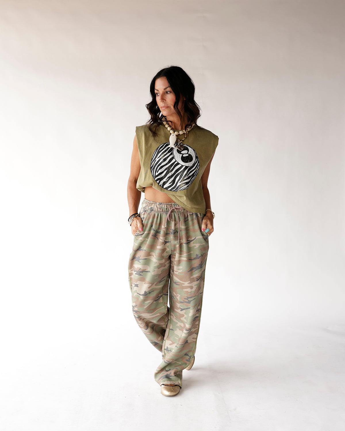 Muted camo wide-leg sweatpants with elastic waist, relaxed oversized fit