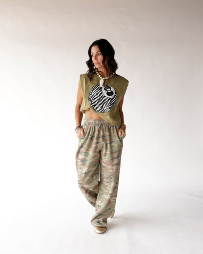 Muted camo wide-leg sweatpants with elastic waist, relaxed oversized fit