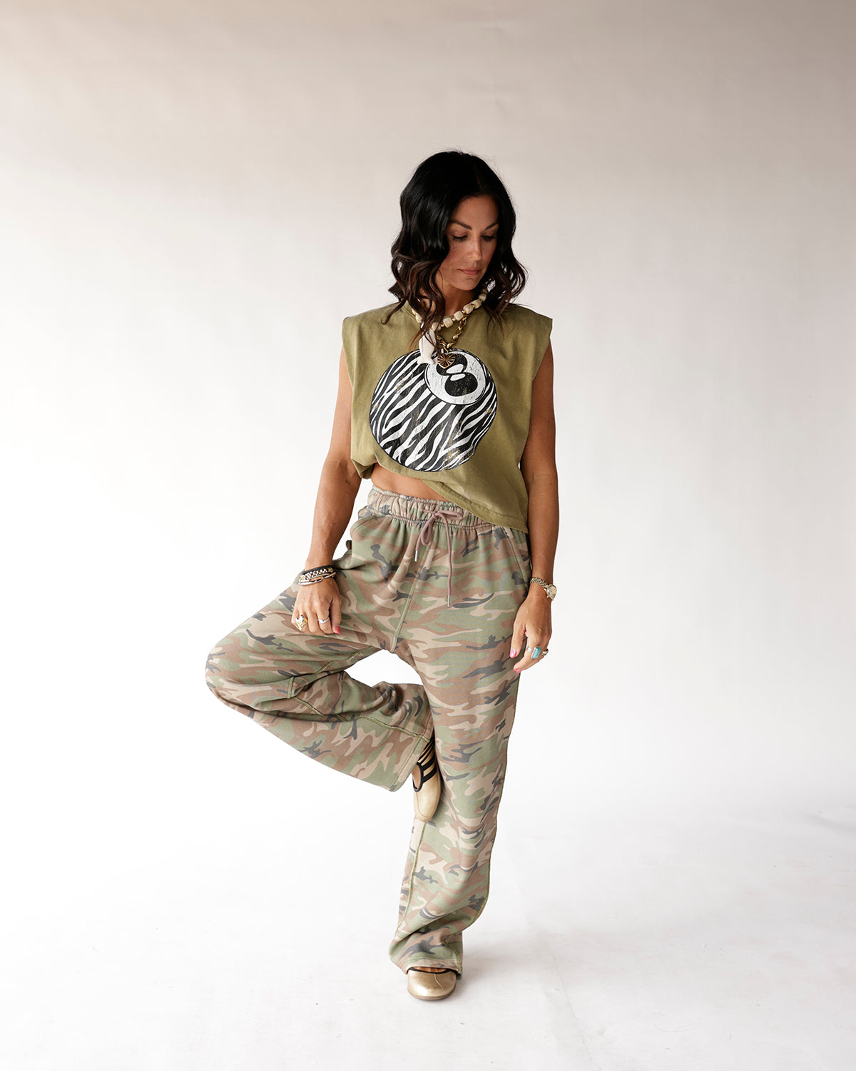 Muted camo wide-leg sweatpants with elastic waist and drawstring tie