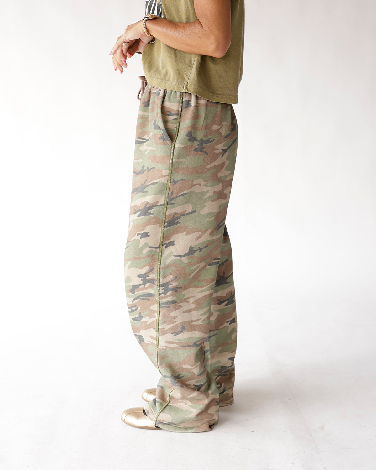 Muted camo wide-leg sweat pants with elastic waist, side seam detail, full length