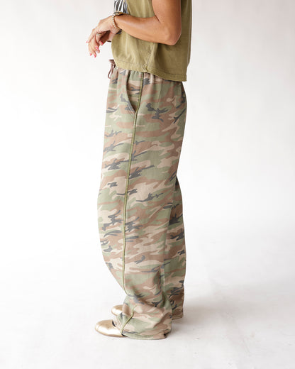Muted camo wide-leg sweat pants with elastic waist, side seam detail, full length