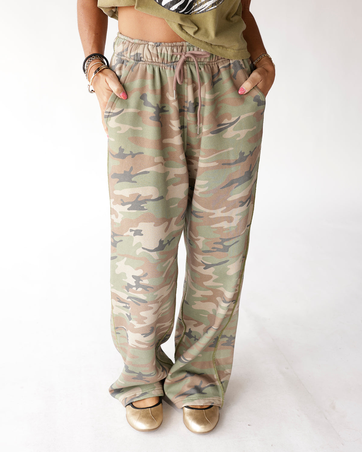 Muted camo wide-leg sweatpants with drawstring waist and side pockets
