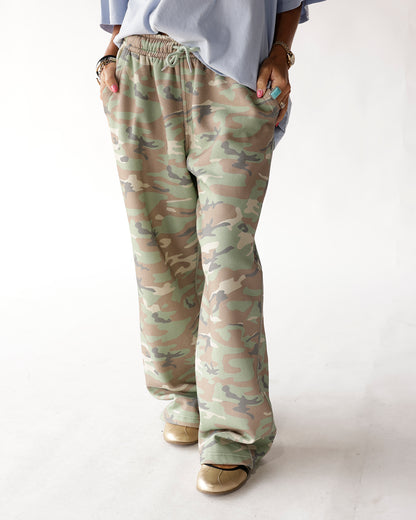 Wide-leg camo sweatpants with drawstring waist, green and tan camouflage pattern